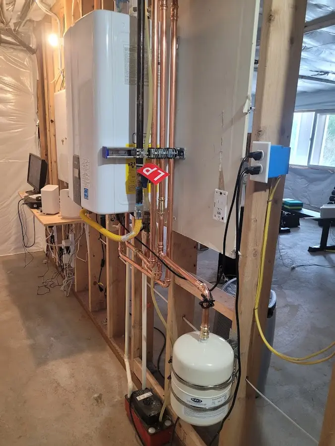 Licensed plumber repairing a kitchen sink in Canby
